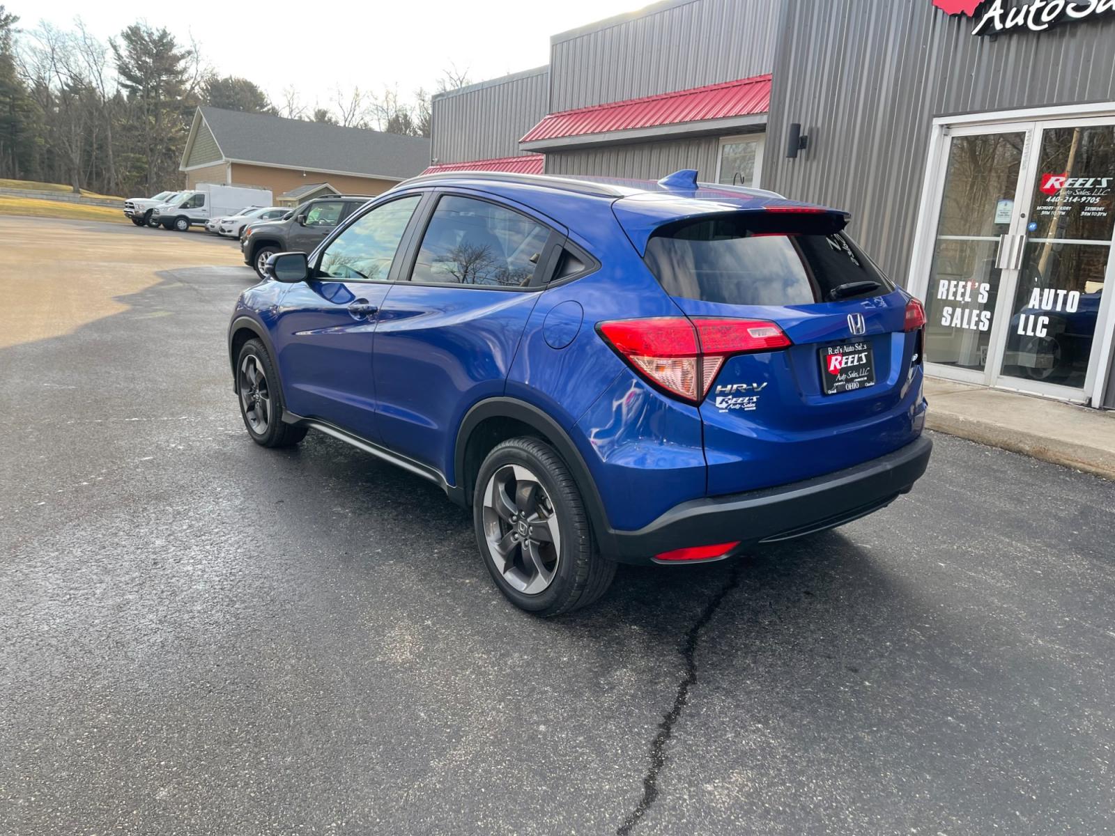 2018 Blue /Black Honda HR-V EX-L w/Navigation 4WD CVT (3CZRU6H71JM) with an 1.8L I4 DOHC 16V engine, Automatic transmission, located at 11115 Chardon Rd. , Chardon, OH, 44024, (440) 214-9705, 41.580246, -81.241943 - This 2018 Honda HR-V equipped with AWD (All Wheel Drive) and a 1.8L engine paired with a CVT (Continuously Variable Transmission) offers a blend of performance and efficiency. Its luxurious leather interior, complemented by heated seats and an automatic climate control system, ensures a comfortable - Photo #9